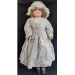 Early 20th century bisque shoulder-head doll by Armand Marseille with kid body, jointed limbs,