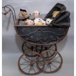 Victorian style pram with hinged canvas canopy, housing 6 teddy bears including 2 small bears by