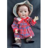 Early 20th century bisque head character doll by William Goebel, with 5 piece bent limb