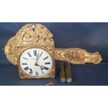 A 19th century French wall clock with simply embossed brass outline showing agricultural labourers