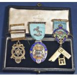 Three masonic medals in silver, two with additional enamelled detail