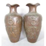 A pair of Japanese copper overlaid terracotta vases with dragon detail. 25cm high.