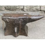 A small old cast iron five footed anvil, 41 cm long x 20 cm high