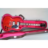 A Westfield red lacquered electric guitar. And hard carrying case.