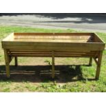 A contemporary freestanding soft wood vegetable trug, 184 cm long x 77 cm wide x 80 cm high (to be