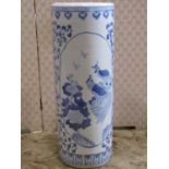 A Chinese ceramic stick stand in a blue and white colourway with birds and foliate detail