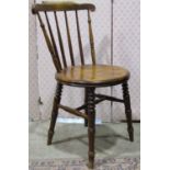 A set of four stained elm and beechwood Swedish stick back dining chairs with circular seats