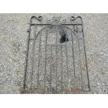 A small iron pedestrian gate with simple scroll and further detail 3ft wide approximately