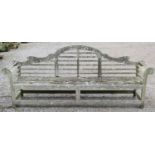 A weathered Lister Lutyens style teak four seat garden/park bench 260 cm long x 54 cm wide x 104