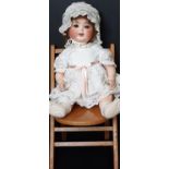 Large bisque head character doll by Ernst Heubach, early 20th century, with blue eyes, open mouth