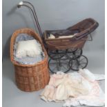 Doll accessories and textiles including a vintage pram, height 71cm, basketwork crib, a further