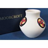 A Moorcroft Pottery 'Flammian Cream' small posy vase, designed by William Moorcroft, 9cm tall