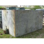 A very large reclaimed galvanised steel water tank of rectangular form with original fittings (water