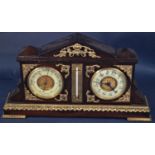 An Edwardian clock / barometer / thermometer, set within a polished timber case with applied brass