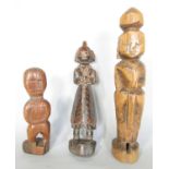 Three Chinese carved wooden figures, the tallest 25cm, (as found)
