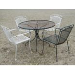 Weathered painted patio suite with lattice and simple scroll detail comprising circular top table,