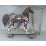 19th century pull along wooden horse with painted finish and real hair mane and tail on articulating