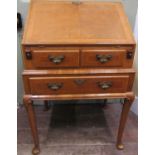 Queen Ann style walnut ladies writing bureau on pad feet, fitted with three frieze drawers, the fall