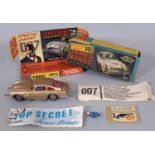 Corgi Toys No. 261 James Bond Aston Martin DB5, in gold with driver, spare bandit and secret