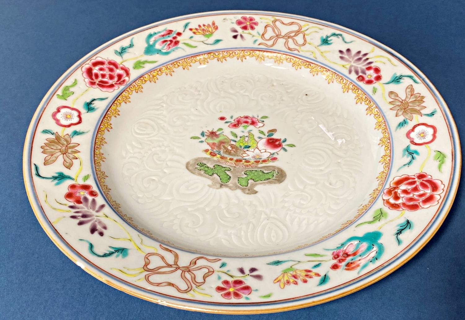 18th Century Chinese famille rose dish, with floral decoration and moulded detail, diameter: 23 cm