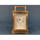 A Garrard & Co carriage clock, the brass case with reeded column supports enclosing an eight day