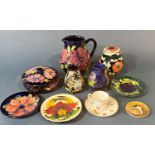 A collection of Moorcroft comprising bowl and cover, water jug, ginger jar and cover, two small