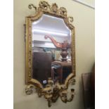 19th century gilded wall mirror, the bevelled edge mirror plate with shaped outline and shell,