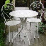A cream painted light steel three piece garden terrace/bistro set comprising circular top table