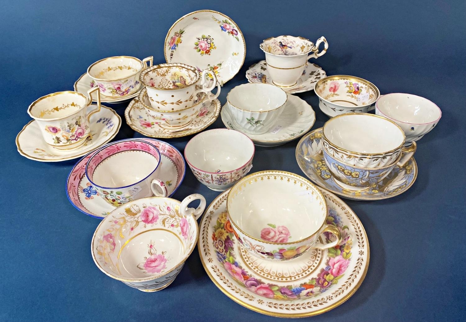 A collection of 18th & 19th century tea bowls and tea cups, many with saucers including examples