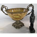 An ornate china fruit bowl enclosed in an Italianate bronze stand with scrolled handles and