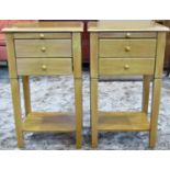 A pair of contemporary two drawer lamp tables with brushing slides, raised on square tapered