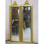 A pair of contemporary gilt framed mirrors with bevelled edge borders within moulded frames