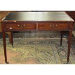 A Georgian mahogany writing table with inset leather top over two real and two dummy frieze