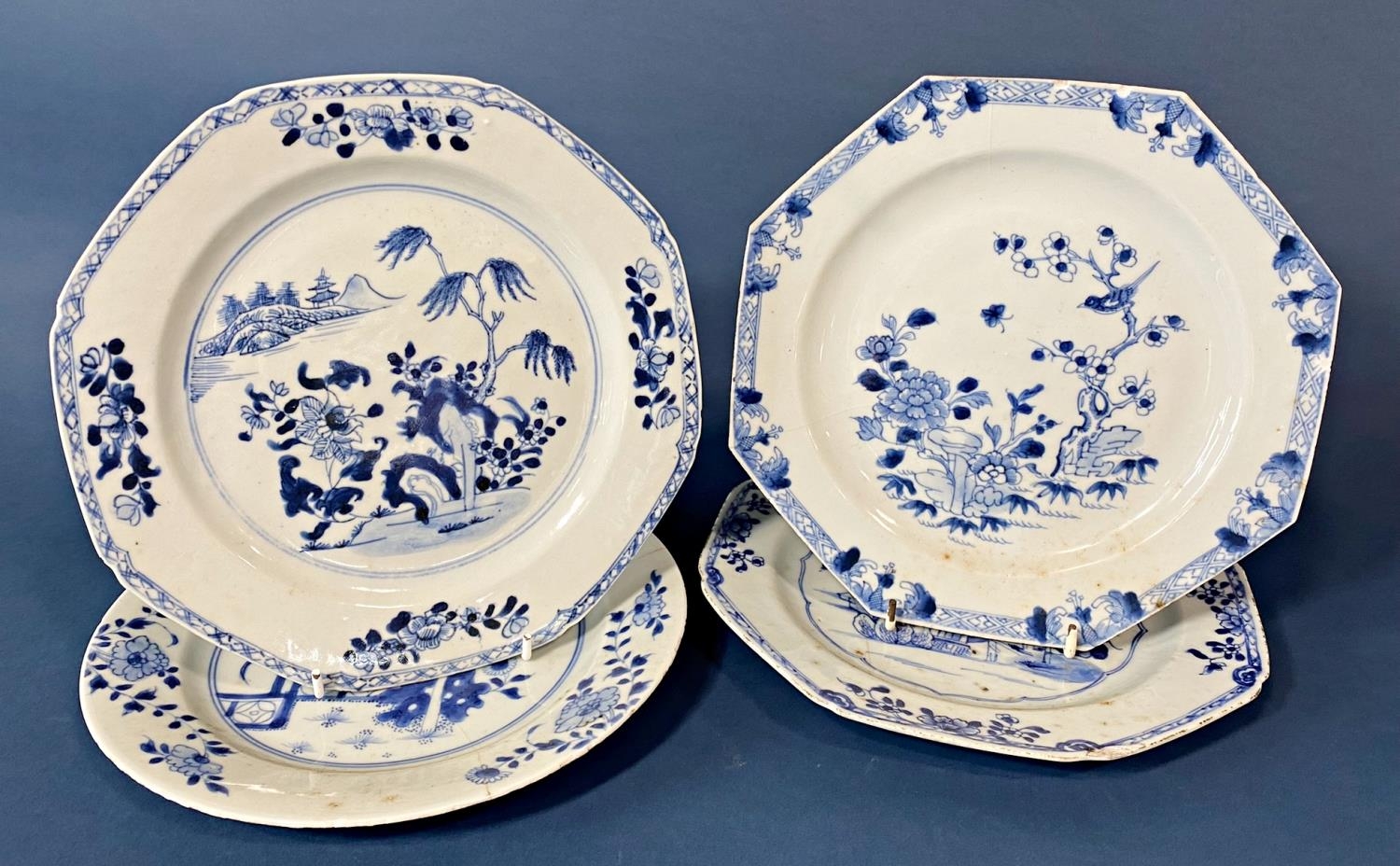 Four 18th Century Chinese blue and white porcelain dishes, with floral decorations depicting