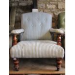 A Victorian drawing room chair with repeating stripped pattern blue and cream ground upholstered