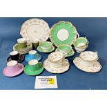 A collection of ceramics including a George Jones tea service in a green scale and gilt colourway, a