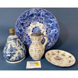 A late 19th century later Delftware comprising dishes, vase and cover, lidded pot, open plates, etc,