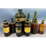A large dark brown Apothecary bottle (lacks stopper) labelled Aq Cinnam 34cm high, six smaller