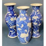 Three Chinese blue and white porcelain prunus vases, each with four-character Kangxi mark to base,