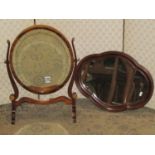 An Edwardian toilet mirror of oval form together with a Victorian style quofoil shaped wall mirror