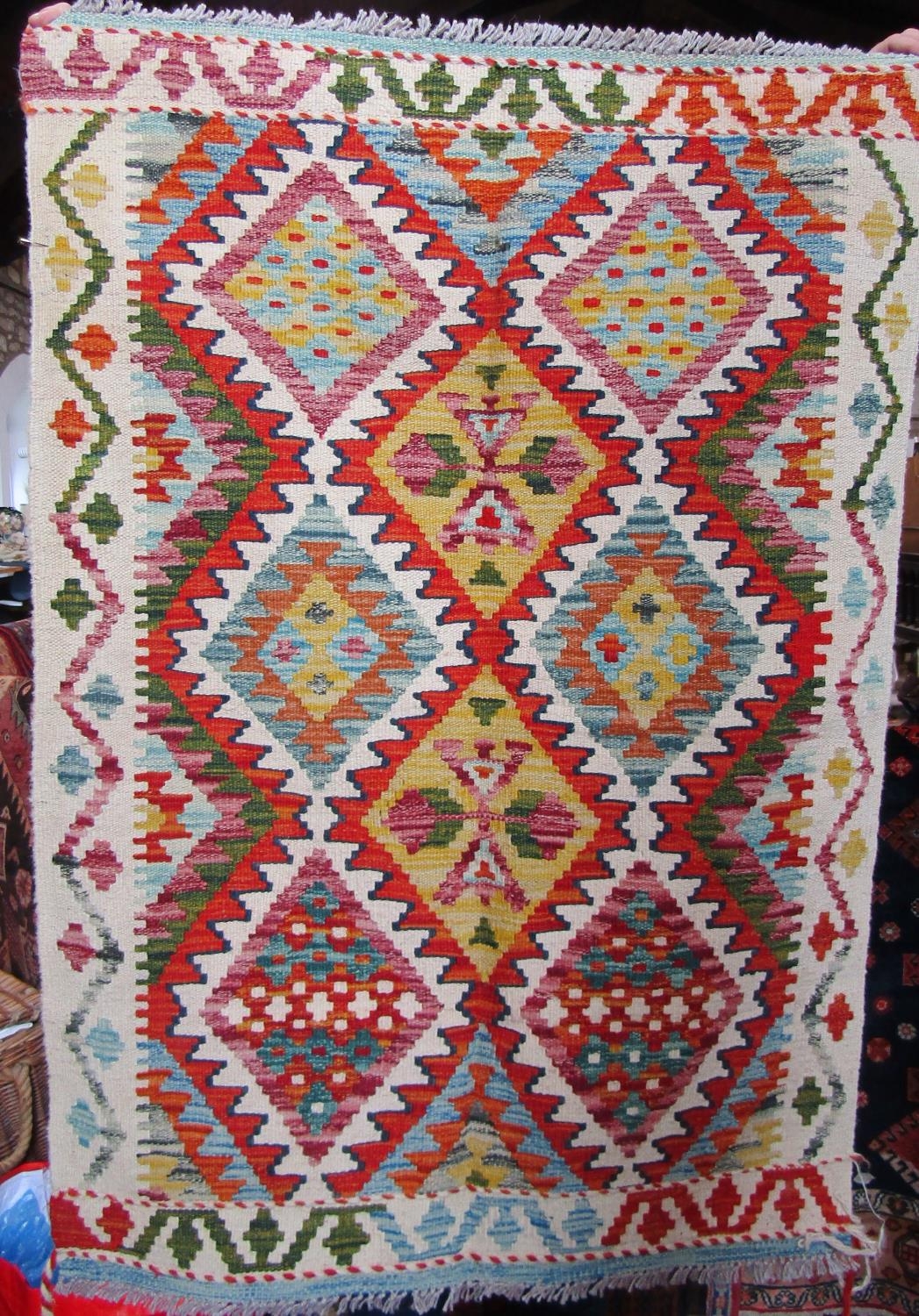 A Chobi Kilim with a multi coloured diamond pattern, 120cm x 85cm approx