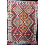 A Chobi Kilim with a multi coloured diamond pattern, 120cm x 85cm approx