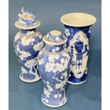Two Chinese blue and white porcelain prunus vases with covers and brush pot (Qing period) to