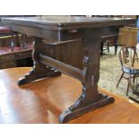 An Ercol dining room suite comprising a sideboard, the central tower of four drawers flanked by