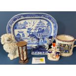A large willow pattern platter, a Delft vase and cover, 19th century twin handled mug with