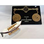 A wall plaque of the brass tiller of Queen Victoria’s Barge and a model of the barge, 2.