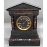 A mid-Victorian period black slate and polished marble mantel clock of architectural form, enclosing