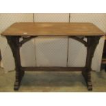 A stained pine gothic revival table, the rectangular top with moulded edge and canted corners raised