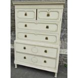 An Edwardian mahogany chest on chest in the Georgian style with painted finish and fitted with an