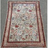 An old floral and bird decorated Persian rug, 140cm x 104cm.